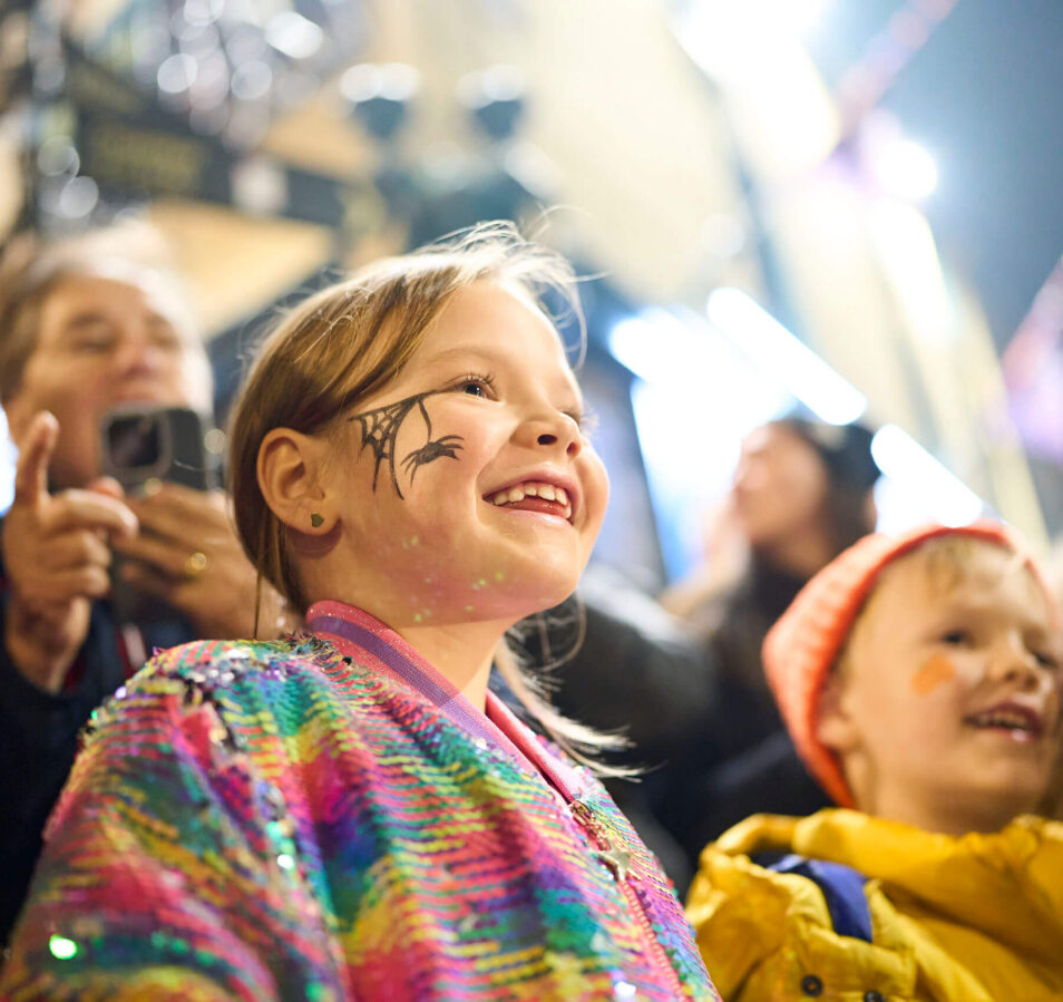 Family enjoying a festive outdoor event near Park Place Apartments, Killarney.