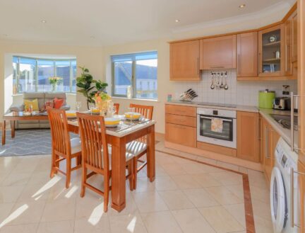 Spacious, sunlit kitchen and dining area at Park Place Apartments, Killarney.