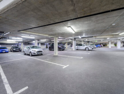 Underground car park at Park Place Apartments, featuring ample parking spaces.