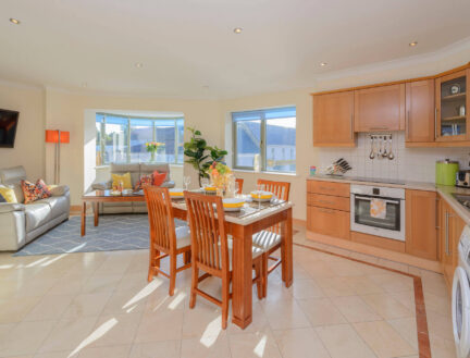 Bright, modern kitchen and living area in a Park Place Apartment, Killarney, perfect for families.