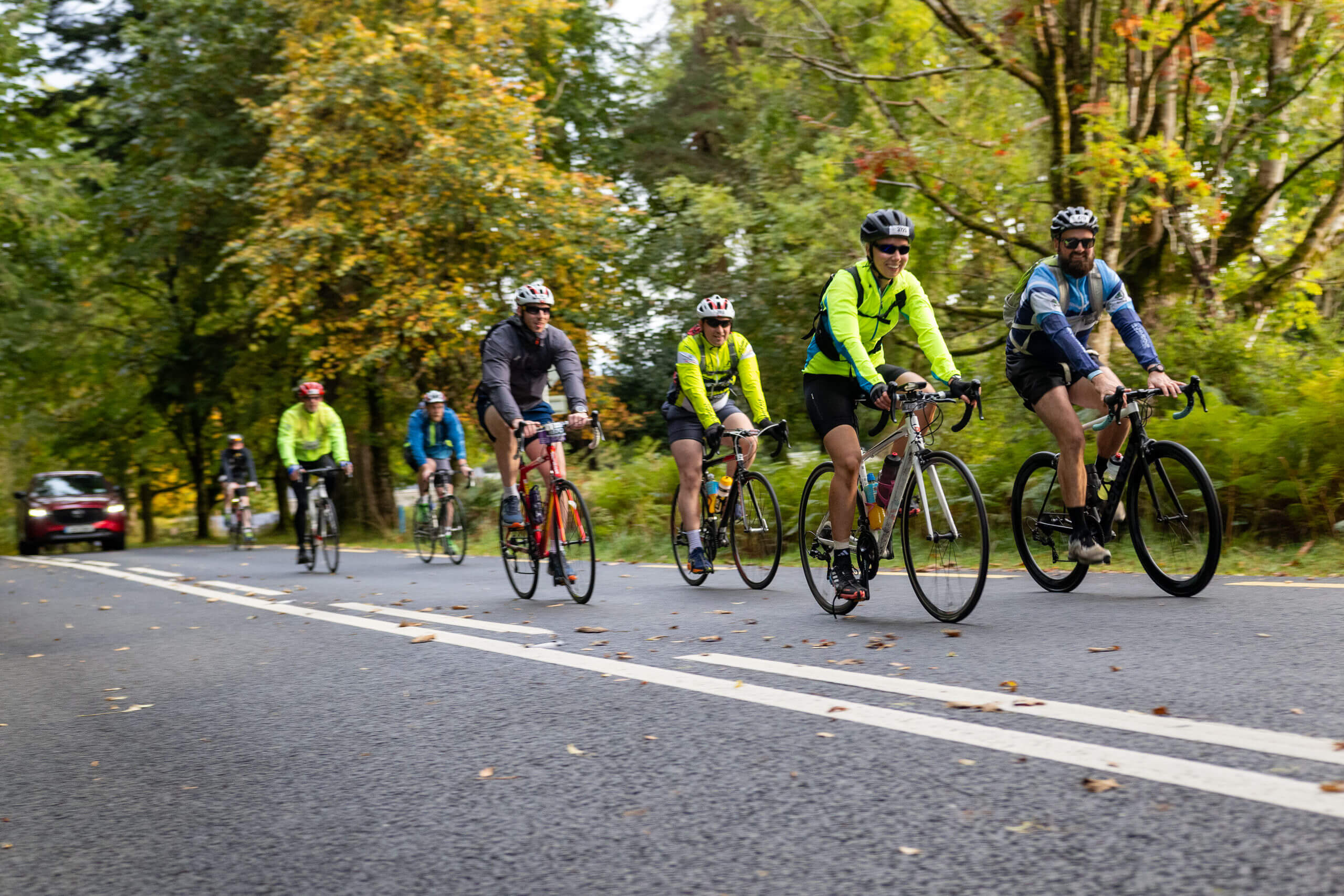 Cyclists enjoy a scenic ride through lush, green landscapes near Killarney.