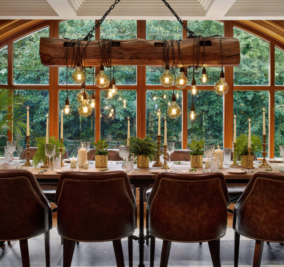 Elegant dining table set for a family, overlooking lush Killarney greenery at Park Place Apartments.