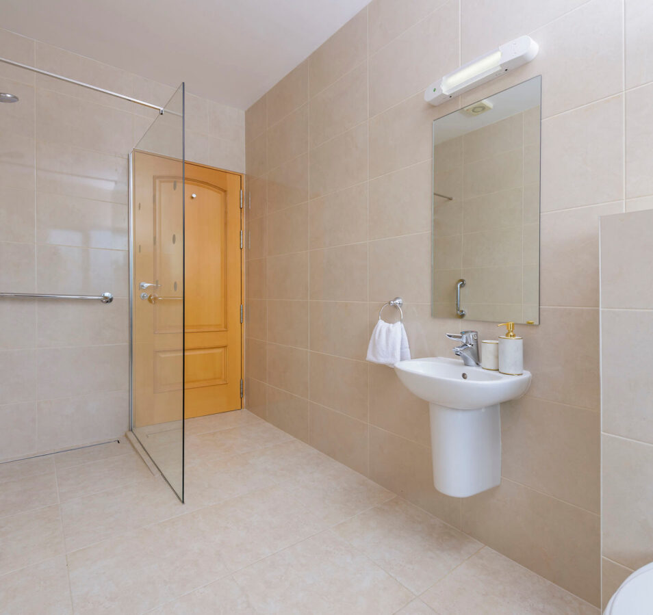Modern bathroom with walk-in shower and sleek basin at Park Place Apartments, Killarney.