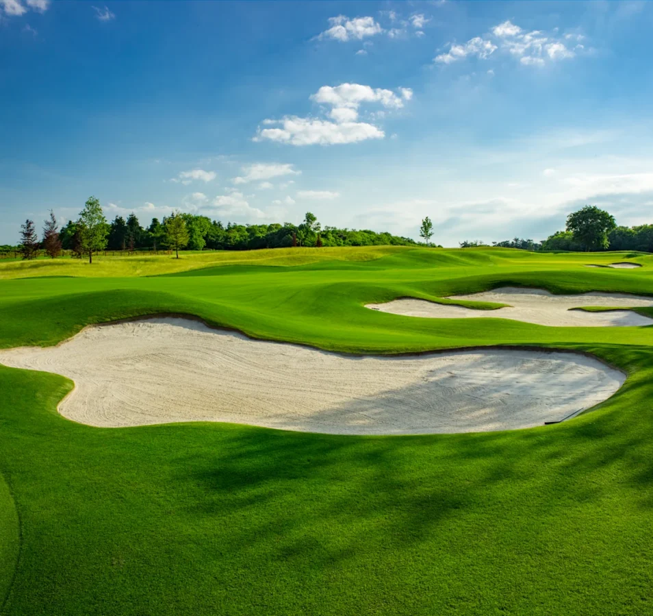 Lush green golf course under clear blue skies near Park Place Apartments in Killarney.