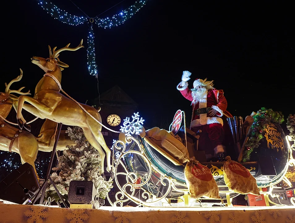 Santa on a festive sleigh surrounded by Christmas lights in Killarney.
