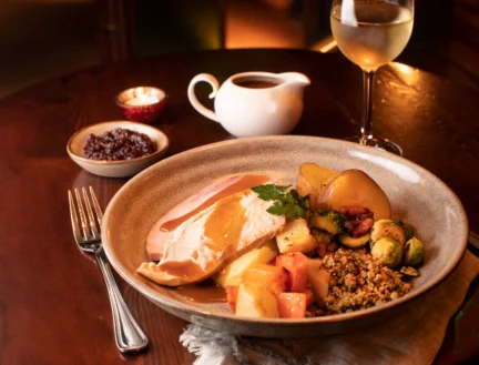 Family enjoying a turkey roast dinner at Park Place Apartments, Killarney.